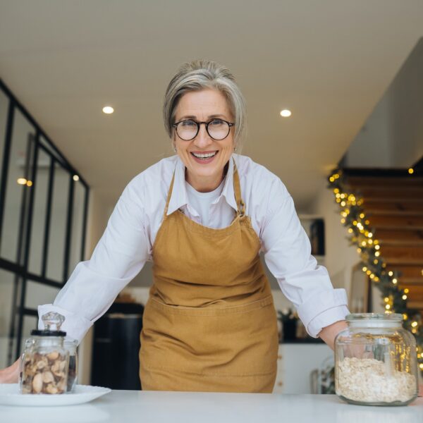 Smiling middle aged mature grey haired woman looking at camera Smiling middle aged mature grey haired woman looking at camera