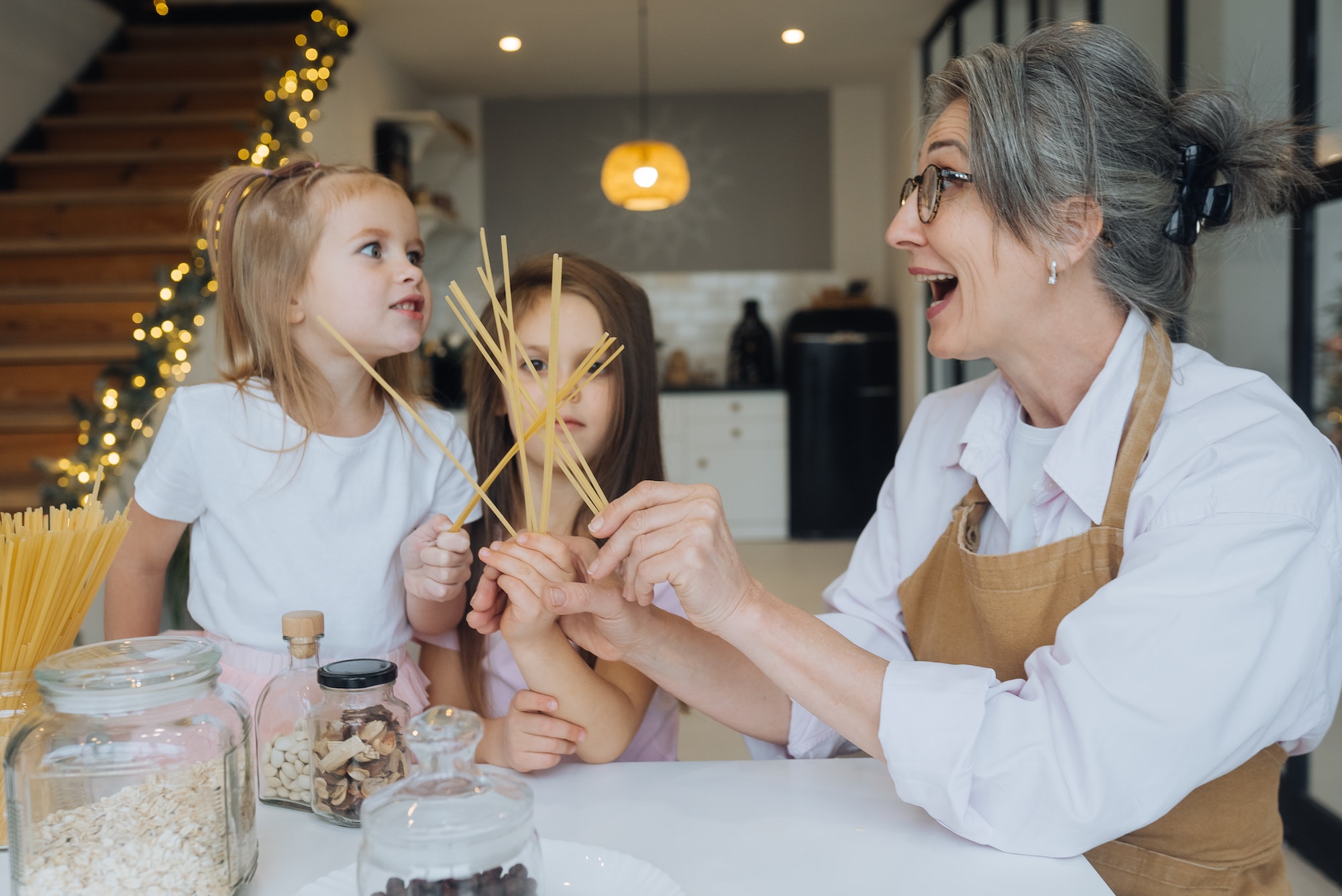 Grandmother and granddaughter are cooking on kitchen